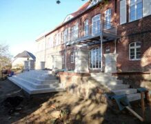 The grand terrace on the south side of the manor house nears completion